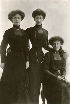 an old black and white photo of three women