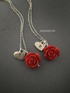 Red rose necklaces with hand stamped initial heart for best friends. Red rose and heart charm are on an 18'' stainless steel chain with lobster clasp. *This price is for 2 necklaces *Stainless steel chain *Stainless steel heart *15mm red rose *Handmade with love <3 Like Jmesjewelrybox on Facebook for updates on new jewelry, upcoming sales and giveaways! Plus Facebook fans save 5% :D Find the coupon code on Jmesjewelrybox's cover photo https://www.facebook.com/Jmesjewelrybox Red Initial Pendant Jewelry For Gift, Red Initial Pendant Jewelry Gift, Red Initial Pendant Jewelry As A Gift, Red Stainless Steel Jewelry For Valentine's Day, Personalized Red Jewelry For Anniversary Gift, Valentine's Day Stainless Steel Necklace, Personalized Red Stainless Steel Jewelry, Valentine's Day Dangle Charm Necklace With Lobster Clasp, Red Jewelry For Valentine's Day Personalized Gift