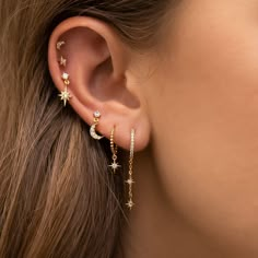 Let the skies shower upon you every day! 18k gold plated, 18k rose gold plated, or rhodium plated over brass with a protective coating Cubic zirconia stones Sterling silver posts 12mm hoop diameter, 21mm dangle length Ušný Piercing, Bijoux Piercing Septum, Minimalist Ear Piercings, Ear Peircings, Cool Ear Piercings, Pretty Ear Piercings, Cute Ear Piercings, Earring Inspo, Piercing Inspo