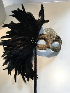 Black Feather mask- Masked ball- New Years Eve- Save Venice -Masquerade Ball- Mardi Gras Mask -Halloween Masked Ball Hello, Perfect for a masquerade party- birthday celebration, or New years eve celebration. This black coque feather rhinestone / sequin gold mask is made with tie. The feathers are about 8 inches. Can be made in: Gold and black mask Solid black mask Silver and black mask Cardboard molded over plastic mask/ makes it durable and then its painted. Custom colors available. Can be made Gothic Full Face Mask For Masquerade, Gothic Full Face Masquerade Masks, Halloween Party Eye Mask Costume Accessories, Halloween Theater Mask, Black Full Face Masks For Costume, Black Full Face Masks For Costumes, Full Face Black Costume Mask, Fantasy Full Face Mask For Masquerade, Gothic Eye Mask For Mardi Gras