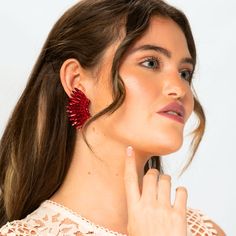 Make a statement with our Red Crystal Wing Earrings! Handcrafted by skilled artisans, these stunning statement earrings feature shimmering red crystals and a unique winged design. Lightweight and comfortable, they're perfect for adding a touch of elegance to any outfit. Ideal for both casual and formal occasions, these earrings exude quality and beauty. Elevate your style and feel confident with our exceptional Red Crystal Wing Earrings, and let the world admire your breathtaking beauty! Size: L Red Metal Earrings For Party, Glamorous Red Metal Jewelry, Red Crystal Metal Earrings For Parties, Red Crystal Metal Party Earrings, Elegant Red Plug Earrings For Party, Red Metal Crystal Party Earrings, Wing-shaped Earrings For Party, Red Drop Earrings For Evening, Red Clip-on Earrings For Evening