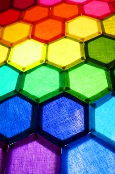 an image of colorful hexagons that are in the color of the rainbow