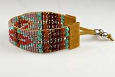 Beaded Boho Bracelet in Lavender, Red & Turquoise  Geometric Design - Loomed Statement Jewelry Bohemian Cuff Bracelet With Hand Wrapped Round Beads, Bohemian Hand Wrapped Cuff Bracelet With Round Beads, Bohemian Hand-wrapped Round Bead Cuff Bracelet, Bohemian Faceted Beads For Festival, Brown Gemstone Beads Bracelets For Festival, Handmade Red Hippie Beaded Bracelets, Bohemian Cuff Bracelet With Round Beads For Festivals, Festival Brown Beaded Bracelets With Gemstone, Bohemian Festival Cuff Bracelet With Round Beads