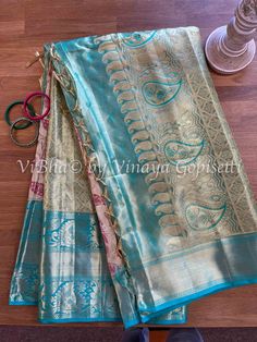 Make a bold statement in this Cream and Turquoise Combo Leaf Pattern tissue Kanjivaram silk Saree and Blouse! Take a risk with the daring combination of colors and patterns and show them who you are. Dare to shine! Blouse Size: 38 Blouse is provided with a room inside on both the sides, to adjust upto next 2 sizes below or above. Saree is finished with fall, pico and pallu tassels. Suitable for Weddings, all festivals and many other special occasions. Turquoise Silk Saree, Turquoise Semi-stitched Saree With Self Design, Festive Turquoise Unstitched Saree, Gold Tissue Saree, Blue Unstitched Tissue Silk Saree, Unstitched Turquoise Saree, Saree And Blouse, Tissue Saree, Kanjivaram Silk Saree