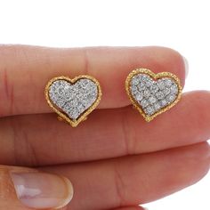 "Buccellati brings the \"everyday wear\" into a Luxury level with these delicate Earrings! Crafted in Solid 18K Yellow & White Gold, These Heart Motif earrings are the perfect fit for a modern woman, who likes to shine everywhere she goes! With a Cluster Pave set Design of 38 Round Cut Diamonds with a total carat weight of 0.60 cts, G-H color, VS clarity. Both Earrings are in Excellent condition, and they have Clip On backs for Non-pierced Ears, Weight: 5.1 Grams Measurements: 12 mm x 14 mm Luxury Diamond Earrings For Valentine's Day, Luxury Heart-shaped Diamond Earrings, Luxury Heart Cut Diamond Earrings, Luxury Heart-shaped Brilliant Cut Earrings, Luxury Heart-shaped Diamond Earrings With Prong Setting, Luxury Diamond Earrings With Accents For Valentine's Day, Luxury Heart Earrings With Diamond Accents For Formal Occasions, Luxury Heart-shaped Diamond Cut Earrings, Luxury Heart-shaped Diamond Earrings For Anniversary