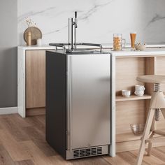 a stainless steel refrigerator sitting on top of a wooden floor next to a bar stool