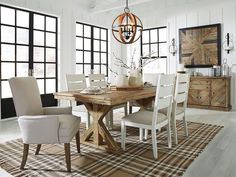 a dining room table with chairs around it