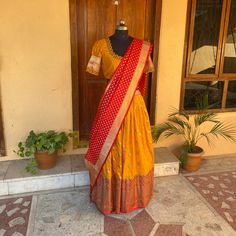 Wedding lehenga choli/ lehenga set with dupatta / teens lehenga/ bridal lehenga/ kids lehenga Indian banarasi half saree / crop top lehenga/ lehenga USA / Langa voni / voggish / yellow red lehenga / pattu pavadai Here is a beautiful and traditional Indian banarasi katan silk lehenga in mustard yellow color with red color border combination is a stunning piece for your upcoming parties!! It's a 3 piece set that includes skirt , hand embroidered blouse and red banarasi dupatta, please find the det Navratri Puja Dress With Dupatta, Festive Yellow Dress For Puja, Bollywood Style Dresses With Pallu For Puja, Anarkali Banarasi Silk Dress With Dori Work, Anarkali Dress With Dori Work In Banarasi Silk, Anarkali Lehenga With Unstitched Blouse For Puja, Festival Dresses With Dupatta For Puja, Dola Silk Lehenga For Puja, Fitted Lehenga For Puja And Navratri