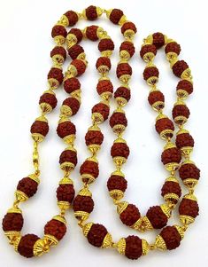 Vintage style certified 22k yellow gold handmade caps with natural rudraksha beads necklace chain awesome unisex jewelry Metal-22kt yellow gold. Weight-20.00 to 27 grams approx.(vary as per length) Width-5 mm. Metal purity -91.6% yellow gold. Stamped-916/22kt hallmarked Length-18 to 26 inches.(select your length) Makes excellent gifting for birthday, wedding, anniversary Christmas day, valentines day, father's day Men Rudraksha Bracelet Gold, Spiritual 22k Gold Jewelry For Diwali, Spiritual 22k Gold Jewelry For Festivals, Spiritual 22k Gold Necklaces For Festivals, Gold Mala As Navratri Gift, Gold Mala For Navratri Gift, Festival Gift Mala Beads, 22k Gold Temple Necklace With Round Beads For Festivals, 22k Gold Temple Necklace With Round Beads As Gift