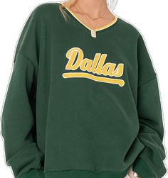 Oversized V-neck Sporty Sweatshirt, Casual V-neck Sweatshirt For Streetwear, Trendy French Terry Tops For College, Trendy Relaxed Fit Sweater For College, Green Cotton Sweater With Logo Print, Oversized Varsity Sweats For Fall, Sporty Cotton V-neck Sweatshirt, V-neck Cotton Sweatshirt With Ribbed Cuffs, Cotton V-neck Sweatshirt With Ribbed Cuffs