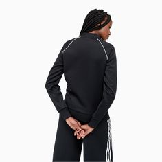 Overview: A SPORTY TRACK JACKET WITH 3-STRIPES STYLE The best of adidas past, remastered for the present. The SST track jacket was originally designed for tennis court warm-ups. This version is made of sleek tricot fabric, which is smooth and slightly shiny on the outside and built with just a bit of stretch for comfortable movement. Features: Regular fit is not tight and not loose, the perfect in-between fit Ribbed SST collar Long sleeves with ribbed cuffs 70% polyester / 25% cotton / 5% elasta Lamb Jacket, Tricot Fabric, Adidas Track Jacket, Adidas Originals Superstar, Adidas Track, Cool Jackets, Track Jacket, Jacket Sale, Tennis Court