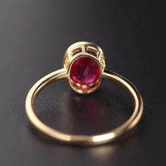 Indulge in the timeless elegance of the Classic Oval Ruby Ring. This luxurious vintage piece is perfect for any occasion - from engagements to birthdays and everything in between. The tension setting adds a unique touch, making it a perfect gift for both men and women. Embrace the beauty of light and dark academia with this stunning piece. Elegant Ruby Ring With Halo Design For Formal Events, Elegant Formal Ruby Ring With Halo Design, Elegant Red Crystal Round Ring, Elegant Red Round Crystal Ring, Elegant Open Ruby Ring For Anniversary, Classic Red Ring With Bezel Setting, Classic Red Rings With Bezel Setting, Elegant Ruby Ring With Prong Setting, Elegant Bezel-set Ruby Wedding Ring