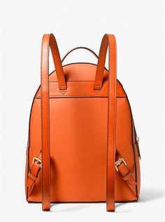 From gym sessions to city commutes, our Sheila backpack has you covered. The faux Saffiano leather style comes with a dedicated pocket inside for your table, as well as a front zip pouch for smaller items. Adjust the buckled leather straps on the back for the perfect drop..• Backpack.• Faux Saffiano leather.• 88.92% coated canvas/11.08% polyester.• Gold-tone hardware.• 9.5”W X 12.25”H X 5”D.• Handle drop: 1.5”.• Exterior details: front zip pocket.• Interior details: back zip pocket, 3 slip pocke Michael Kors Backpack For On-the-go, Michael Kors Leather Backpack With Zipper, Michael Kors Travel Bag With Adjustable Strap, Michael Kors Modern Standard Backpack, Modern Michael Kors Standard Backpack, Michael Kors Backpack With Zipper Closure For On-the-go, Michael Kors Leather Backpack For Travel, Michael Kors Leather Backpack With Zipper Closure, Casual Michael Kors Backpack With Adjustable Strap