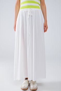 Introducing our stunning Maxi Skirt in White Fluid Fabric with Elastic Waist, a versatile and chic addition to your wardrobe that exudes effortless bohemian style. Crafted from lightweight woven fabric made of 100% viscose, this skirt offers both comfort and elegance.  The full-length design and relaxed fit create a flowing silhouette that's perfect for any occasion, whether you're strolling along the beach or attending a summer soirée. The elastic waistband ensures a comfortable and customizable fit, while side pockets add a practical touch.  Pair this skirt with a simple tank top for a casual daytime look, or dress it up with a blouse and statement jewelry for a more polished ensemble. However you style it, this maxi skirt is sure to make a statement wherever you go.  Please note that th Flowy Maxi Skirt, Simple Tank Tops, Flowy Maxi Skirts, Boho Fabric, Summer Soiree, Spring Weather, Skirt Jumpsuit, Scarf Headband, Estilo Boho