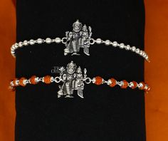 This amazing silver Rakhi crafted from 925 silver with immense precision. It exudes excellent craftsmanship and will surely look wonderful on your brother's wrist. handmade custom design God divine Bracelet Or Rakhi bracelet with silver, rudraksha and holy Basil Rosary beaded chain, this is special design beaded bracelet we can use either Rakhi bracelet or daily use bracelet for unisex. Best Rakshabandhan Festival best wishes sibling gift for your brother and sister's , Metal-925 sterling silver Silver Bracelets For Navratri, Adjustable Silver Bracelets For Diwali, Silver Bracelet For Navratri Festival, Silver Bracelet For Navratri Rituals, Silver Bracelet For Navratri Festive Occasion, Silver Bracelets For Navratri Rituals, Festive Silver Bracelets For Navratri, Silver Temple Jewelry Bracelets For Ceremonial Occasions, Ceremonial Silver Temple Jewelry Bracelet