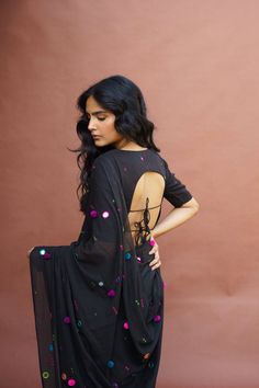 This beautiful Black saree in Mulmul features intricate mirror work motifs inspired by the Rabari embroidery. It is finished with a tassel bunch on the ends.This saree comes with a Black blouse piece with mirror embroidery Color: Black Material: Mulmul fabric with mirror embroidery and thread work Quantity: 1 Wash & Care: Dry clean only This product has been crafted by hand and may have slight irregularities or imperfections in color or embellishment. These irregularities are the result of the h Semi-stitched Cotton Silk Pre-draped Saree With Mirror Work, Bollywood Style Cotton Silk Saree With Dori Work, Cotton Silk Saree With Mirror Work For Eid, Unstitched Cotton Silk Saree With Mirror Work, Eid Cotton Silk Saree With Mirror Work, Festival Pre-draped Saree With Dori Work In Cotton Silk, Pre-draped Cotton Silk Saree With Dori Work For Festivals, Festive Cotton Silk Pre-draped Saree With Dori Work, Bollywood Cotton Silk Saree With Mirror Work