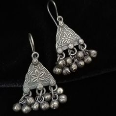 German Silver earrings/Silver Earrings/Silver Oxidized Ghungroo Earrings/Indian Earrings/Indian Jewelry/Tribal Jewelry/Silver - Earrings Length: 2 Inches - Comes with Push back Closure - Lightweight Earrings - German Silver Oxidized Earrings with simulated stones in Two Tone finish. - Very Elegant and stylish, these Earrings can be paired with any Attire depending upon the occasion and the theme. - The base is pure brass (90%) and pure 92.5 silver (10%) which makes this very sturdy and of good q Traditional Silver Nickel-free Danglers, Nickel-free Traditional Silver Danglers, Silver Vintage Danglers, Traditional Sterling Silver Earrings For Festivals, Traditional Sterling Silver Plug Earrings, Traditional Sterling Silver Pierced Danglers, Traditional Engraved Teardrop Earrings, Silver Engraved Teardrop Earrings, Vintage Silver Danglers For Festive Occasion