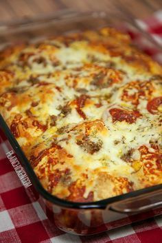 a square casserole dish on a red and white checkered tablecloth,