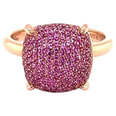 This is a beautiful authentic ring from Tiffany & Co. by designer Paloma Picasso from her Sugar Stacks Collection. It is crafted from 18k rose gold with a polished finish. The top of the ring has a cushion shape bridge with a high dome set with gorgeous pave pink sapphires, the dome is secured by 4 sturdy prongs. The ring is signed by the designer with the gold content. Brand: Tiffany & Co. Hallmark: Tiffany & Co. Au750 Italy Paloma Picasso Pink Sapphires: 0.85ct Measurements: top: 0.50" x 0.50" Luxury Pink Gold Ring With Pink Sapphire, Luxury Red Pink Sapphire Ring, Luxury Pink Sapphire Ring In 14k Gold, Rose Gold Pink Sapphire Rings - Fine Jewelry, Tiffany And Co Paloma Picasso Rings, Paloma Picasso, Ring Rosegold, Tiffany And Co, Domed Ring