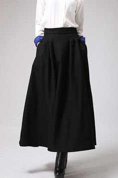 Fluidity and elegance from this chic long maxi autumn winter skirt, Craft with wool fabric, featuring elegant pleated detail waist, Team this long skirt  with a chunky sweater, winter boots and an oversized handbag and you're good to go, no matter what the weather throws at you! DETAILS:* Buy Now at Etsy* 30% wool, 30% fiber, 40% polyester* polyester lining* Fitted waist* Seam pockets* Side Zip closure* Ankle length* Dry Clean * Fast shipping service Provided❤ Handmade with Love, Unique and Chi Winter Black Wide Leg Skirt, Chic Wide Leg Winter Skirt, Chic Long Skirt Bottoms For Winter, Winter Solid Color Pleated Maxi Skirt, Fall Workwear Full Length Maxi Skirt, Fall Workwear Full-length Maxi Skirt, Fall Maxi Skirt For Workwear, Winter Wide-leg Solid Color Skirt, Winter Wide Leg Solid Color Skirt