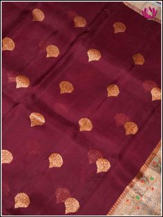 Experience grace, luxury and class with this lightweight Banarasi Kora silk saree in an eye catching hues of Maroon and light blue. Perfect for any occasions, this features a golden woven motif with a grand zari woven Meenakari border. Grand pallu adds charm with custom handmade tassels complementing the grandeur. It comes with a unstitched blouse piece. Silk Mark Certified. Handloom Banarasi Kora silk. Custom handmade tassels on pallu Fall and Pico - Done Blouse - Unstitched Please note: Color Kora Silk Sarees, Blouse Piece, Silk Saree, Silk Sarees, Tassels, Light Blue, Saree, Textiles, Things To Come