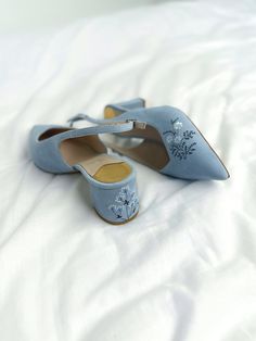 Wedding slingback pumps 'Tati' are handcrafted from something blue Italian suede. The pair of bridal heels features handmade floral embroidery with wildflowers and vines that can be customized to your preference.  This design also has pointy toes and 5.5 cm / 2.2 inches stable block heels that are also embroidered in the same pattern. These wedding shoes are designed with a V-notched vamp (v-cut) and closed toe which makes bridal sandals even more elegant and special. Take note that the base of Blue Bridal Shoes Low Heel, Low Heel Bridal Shoes, Wildflower Embroidery, Colorful Wedding Shoes, Stable Block, Fun Wedding Shoes, Wedding Pumps, Shoes Socks, Bridal Sandals