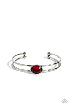 Encased in a studded silver frame, a fiery red gem sits atop a layered silver cuff, creating a mesmerizing centerpiece around the wrist. Sold as one individual bracelet. Elegant Metal Cuff Bracelet With Gemstone, Elegant Red Metal Cuff Bracelet, Formal Red Metal Bracelets, Red Metal Cuff Bracelet Bangle, Red Metal Bangle Cuff Bracelet, Red Adjustable Metal Cuff Bracelet, Adjustable Red Metal Cuff Bracelet, Red Bangle Jewelry With Jewels, Red Metal Cuff Bracelet