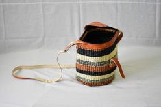 This bag is mainly hand woven to bring out a good touch of fashion,this sling bag is very efficient especially when going for shopping,woven with sisal and some leather straps attached Traditional Bucket Bag With Adjustable Strap For Everyday, Vacation Woven Leather Pouch Shoulder Bag, Woven Leather Pouch Shoulder Bag For Vacation, Handwoven Pouch Shoulder Bag For Daily Use, Bucket Straw Bag With Adjustable Strap As Gift, Daily Use Handwoven Pouch Shoulder Bag, Leather Basket Shoulder Bag With Adjustable Strap, Bohemian Woven Leather Bucket Shoulder Bag, Gift Crochet Bucket Bag With Adjustable Strap