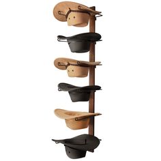 a wall mounted shelf with several wooden spoons hanging from it's sides and two metal hooks on each side