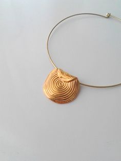 Beautiful minimalist necklace made with a gorgeous ethnic brass pendant, nickel free. It is a stunning piece, perfect to make everyone's attention turned on you. Contains no lead or nickel. Do not perfume over it or subject it to any liquid substances. I love the pure metal. But over time, metal will darken slightly, but when you rub stationery eraser, brilliance will return. The style of choker depending the availability. Composition: I always use natural materials, in this case real brass. The Minimalist Festival Jewelry With Pendant, Minimalist Festival Pendant Jewelry, Gold Circular Jewelry For Festivals, Gold Circle Jewelry For Festivals, Gold Circular Festival Jewelry, Round Brass Choker For Gift, Minimalist Brass Jewelry With Large Pendant, Round Brass Choker Gift, Gold Minimalist Necklace For Festivals