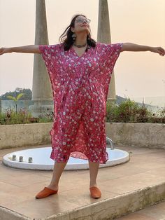 This is our "Timeless" style kaftan. It features a drawstring that you can cinch at the waist. This loose fitting Caftan House dress is exceptionally comfortable and stylish.As for the fabric pattern, we have used a hand drawn and digitally painted technique. So they are all unique designs. It is like wearing wearable art. What I love about digital paintings is that they look as beautiful as the hand paintings but the care needed for them is much less. You can wash them on a gentle cycle and han Casual V-neck Kaftan For Daywear, Bohemian Drawstring Dress For Vacation, Bohemian Dress With Drawstring, Beach Dress With Drawstring And Short Sleeves, Bohemian Vacation Dress With Drawstring, Short Sleeve Drawstring Beach Dress, Beach Cover-up Kaftan With Tie Waist, Beachwear Kaftan With Tie Waist For Beach Cover-up, V-neck Beach Dress For Loungewear