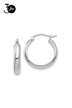 Rhodium over 14K white gold hoop earrings. Measure approximately 13/16"L x 1/8"W and have saddleback backings. Everyday Small Hoop Hinged Jewelry, Everyday Small Hoop Hinged Earrings, Classic Nickel-free Huggie Earrings, Classic Small Hoop Sterling Silver Jewelry, Silver Oval Tarnish Resistant Hoop Earrings, Sterling Silver Rounded Jewelry With Polished Finish, Sterling Silver White Gold Hoop Earrings, Classic Sterling Silver Hoop Earrings For Formal Events, White Gold Sterling Silver Hoop Earrings