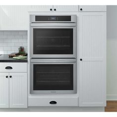 two ovens are built into the wall in this kitchen