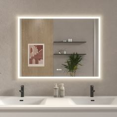 a bathroom with two sinks and a large mirror over it's wall mounted faucet