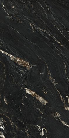 black marble with white and brown streaks on it