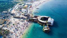 an aerial view of the beach and pier