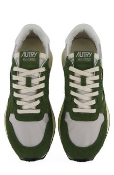 A mixture of textures gives a dynamic look to this sporty sneaker set on a grippy running sole. Lace-up style Textile and leather upper and lining/synthetic and rubber sole Imported Green Running Sneakers With Rubber Waffle Outsoles, Green Running Shoes With Abzorb Midsole For Jogging, Green Custom Sneakers With Abzorb Midsole For Running, Green Leather Sneakers For Jogging, Green Custom Sporty Sneakers For Running, Sporty Green Running Shoes With Vibram Sole, Green Athleisure Sneakers With Vibram Sole, Sporty Green Sneakers With Vibram Sole, Green Sporty Custom Sneakers With Vibram Sole