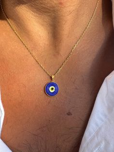 A Blue Evil Eye Necklace for men that is made from Sterling Silver 925 with a really one of a kind charm at the center of it that is passed through an elegant gold plated sterling silver 925 chain. The Evil eye is made from Pasta and its shape is round. Each evil eye is different from the other because its made on hand and its impossible to make them all of them exactly the same. Discover this remarkable piece at Christina Christi Store and make a bold statement with this one-of-a-kind accessory Blue Round Pendant Necklace For Good Luck, Good Luck Sterling Silver Tarnish-resistant Jewelry, Tarnish-resistant Sterling Silver Good Luck Jewelry, Blue Sterling Silver Charm Necklaces For Gifts, Symbolic Blue Necklace With Round Pendant, Handmade Blue Sterling Silver Charm Necklace, Symbolic Blue Round Pendant Necklace, Blue Symbolic Nickel-free Jewelry, Symbolic Blue Nickel-free Jewelry