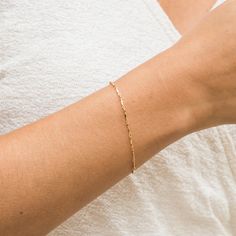 For those looking for a dainty bracelet that is absolutely darling, meet our Dapped Chain Bracelet. This bracelet is very lightweight and comfortable, making it perfect to wear all the time! We love it paired with the Chunky Curb Chain Bracelet. DETAILS 14k gold filled -or- sterling silver chain, lobster clasp, & findings Bracelet length: 6.5" with 1.5" extender Safe for sensitive skin & shower safe Matching necklace: Dapped Chain Necklace Gold Bracelet For Women Dainty, Simple Chain Bracelet, Permanent Bracelet, Bracelets Simple, Gold Bracelet Simple, Bracelet Styles, Dainty Gold Jewelry, Curb Chain Bracelet, Permanent Jewelry