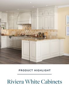 a kitchen with white cabinets and wood floors