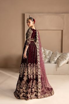 Royal Maroon Bridal Lehenga and Choli Pakistani Dress is an embellished attire adorned with lavish designs and hand-crafted details of ornaments. Premium raw silk fabric make this Lehenga Choli an epitome of beauty and your foremost priority to have a head-turning look. Lehenga Choli: The choli has maroon color and is gracefully embellished with zardosi, dabka, naqshi, pearls, tilla, crystals, and Resham. Kundan work gives a chic look to the choli. Shimmering ornaments and floral designsmake this choli a perfect choice to pair with the Bridal Lehenga. Bridal Lehenga: This Bridal Lehenga is emblazoned with the intricate designs, dabka, naqshi, kora, Resham work, sequins, crystals, and motifs. The Lehenga has a huge flare and is adorned with beautiful shimmering details. The fabric of this L Marron Lehenga Bridal, Bridal Lehenga Collection Maroon, Pakistani Bridal Lehenga Maroon, Deep Maroon Bridal Lehenga, Maroon And Gold Bridal Lehenga, Maroon Pakistani Bridal Dress, Maroon Bridal Lehenga, Bridal Lehenga Pakistani, Maroon Lehenga