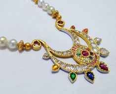 Vintage antique 23 K solid gold and natural Navratna gemstones set large pendant strung together with pearls and gold beads. Great one of type collection piece in very good condition. Length-Free size, Size of pendant-10/9 cm, gross weight-137 grams, pendant weight only-76 grams, Material-23 K gold, Natural uncut Diamonds, and Natural Navratna gemstones. Gemstone Pendant Necklace, Gold Anklet, Ankle Chain, Silver Flats, Gold Flats, Uncut Diamond, Gemstone Necklace Pendant, Chains For Men, 22k Gold