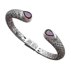 Resembling a weave intricate patterns in sterling silver circle the wrist with elegance. Balinese artisan Giri Tasmana creates this cuff bracelet which culminates in faceted teardrops of garnet that total 2.5 carats altogether. This bracelet opens with a concealed hinge to fit the wrist. Elegant Oxidized Finish Cuff Bracelet For Formal Occasions, Sterling Silver Cuff Bracelet With Intricate Design, Bohemian Sterling Silver Bracelet For Formal Events, Bohemian Sterling Silver Bracelet For Formal Occasions, Silver Circle, Sterling Silver Dangle Earrings, Silver Art, Jewelry Online Shopping, Balinese