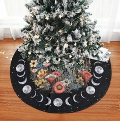 a christmas tree skirt with the moon and stars on it