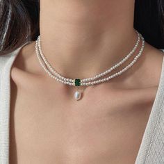 ✦ 𝐈𝐭𝐞𝐦 𝐃𝐞𝐬𝐜𝐫𝐢𝐩𝐭𝐢𝐨𝐧    Elevate your style with our exquisite Emerald Pendant Choker--a captivating blend of vintage charm and natural beauty. This stunning necklace features genuine emerald green stones and lustrous pearls, creating a timeless piece that exudes elegance. Perfect for a vintage-inspired look or a thoughtful Valentine's gift for her, this necklace effortlessly combines sophistication with a touch of romance. Adorn yourself or a loved one with this unique Natural Stone Luxury Green Pearl Drop Necklace, Luxury Temple Jewelry Beaded Necklace With Pearl Chain, Adjustable Vintage Pearl Necklace, Luxury Elegant Purple Pearl Necklace, Luxury Gold Classic Beaded Necklaces, Luxury Green Festive Choker, Pearl Gold Necklace, Emerald Green Necklace, Pearl Necklace Choker