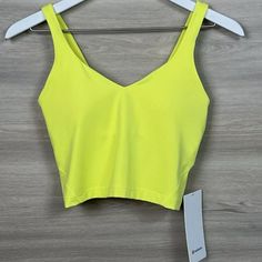 Nwt Lululemon Align Cropped Style Tank Top Electric Lemon Yellow Size 12 Gorgeous Nwt When Feeling Nothing Is Everything. The Align Collection, Powered By Nulu Fabric, Is So Weightless And Buttery Soft, All You Feel Is Your Practice. Nulu Lightweight, Buttery-Soft Nulu Fabric Wicks Sweat And Is Four-Way Stretch Buttery-Soft Handfeel Lightweight Sweat-Wicking Four-Way Stretch Features Designed For: Yoga Light Support: Built-In Shelf Bra Intended To Provide Light Support. Sizes 0-14 Fit A/B Cups, Lulu Outfits, Yoga Light, Lululemon Align Tank, Lululemon Outfits, Style Tank Top, Athletic Clothes, Running Tank Tops, Preppy Clothes, Purple Tank