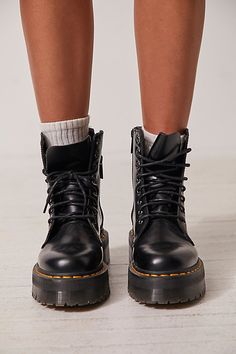 **Fit Note:** If in between whole sizes, we recommend sizing down. The original Dr. Martens 8-eye boot is reimagined with a bold chunky platform but stays true to the classic style featuring an iconic rubber air-cushioned sole and yellow stitching. * Smooth leather * Grooved sides * Side zipper closure * Goodyear Welt design, upper and sole are sewn together * Slip resistant | Dr. Martens Jadon Lace-Up Boots at Free People in Black, Size: US 6 Fall Streetwear Lace-up Boots With Leather Footbed, Fall Streetwear Boots With Zipper Closure, Fall Streetwear Boots With Zipper, Fall Streetwear Boots With Padded Ankle, Padded Ankle Boots For Streetwear In Fall, Leather Footbed Combat Boots For Fall Streetwear, Fall Streetwear Moto Boots With Reinforced Heel, Winter Leather Footbed Moto Boots For Streetwear, Trendy Winter Boots With Vibram Sole