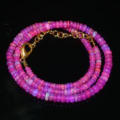 Natural Ethiopian Pink Fire Opal Smooth Rondelle Beads Necklace Gemstone Type :  Natural Item Code :   0329 Origin-:100% Natural Pink Fire Opal Necklace Grade-:  AAA++ Stone shape-: Smooth Rondelle Beads Stone color-: Dark Pink Opal Same As Picture Metal-: Length-: 16 Inch Quantity-: 1 Strand Necklace Approx Weight   :  47.10 Carat    Approx Size        :   3-5 MM 100% Genuine & Natural ABOUT US skgemsstone based in Jaipur, India is a company engaged in supplier, manufacturing, wholesale and ret Pink Opal Round Beads Necklace For Gift, Single Strand Pink Opal Necklace With Round Beads, Pink Opal Single Strand Beaded Necklace As Gift, Beaded Pink Opal Necklaces For Jewelry Making, Pink Opal Necklace, Pink Opal Round Beads Necklace, Pink Opal Round Beads For Jewelry Making, Opal Single Strand Beaded Necklace For Gifts, Pink Opal Beaded Necklace For Gift