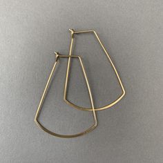 These modern geometric earrings are very versatile. Nickel free & hypoallergenic. Makes a great gift and comes custom wrapped in a box with a polishing cloth and care guide. Dimensions: 33 mm wide 43 mm long Modern Gold Jewelry For Everyday Use, Modern Gold Brass Hoop Earrings, Modern Nickel-free Hoop Earrings For Everyday, Everyday Modern Nickel-free Hoop Earrings, Modern Hypoallergenic Brass Jewelry, Modern Metal Hoop Earrings For Everyday, Modern Metal Hoop Earrings For Everyday Wear, Gold Geometric Earrings For Everyday, Modern Geometric Metal Hoop Earrings