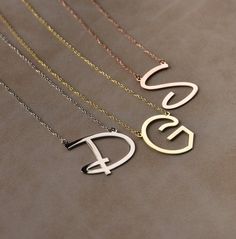 You can customize this necklace with a letter of your choice. All our necklaces are suitable for all kinds of clothing and add a great sparkle to your wardrobe.  #personalizednecklace #weddingift #14kgoldnecklace #personalizedchoker #customnecklace #personalizedjewelry #personalizedgift #namenecklace #initialnecklace #lovegifts #personalizedpendant #birthdaygiftromantic #romanticgifts #giftsforbestfriend Stainless Steel Initials Name Necklace, Gold Initial Necklace With Letter Print As Gift, Elegant Customized Initial Pendant Necklace, Customized Elegant Initial Pendant Necklace, Initial Pendant Necklace With Letter Print For Gift, Customizable Initial Pendant Necklace For Valentine's Day, Letter Print Initial Pendant Necklace As Gift, Gift Letter Print Initial Pendant Necklace, Minimalist Monogram Letter Name Necklace